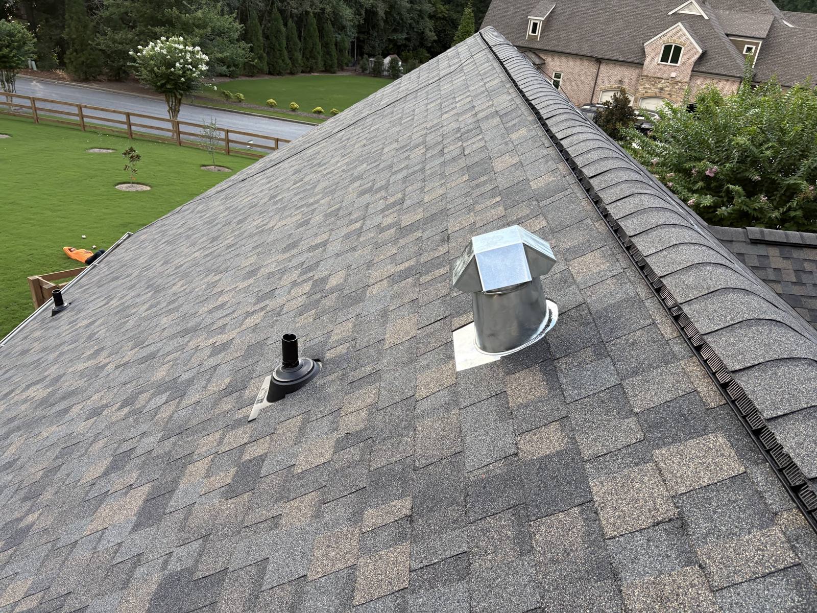 Close-up of new architectural shingles with roof vents