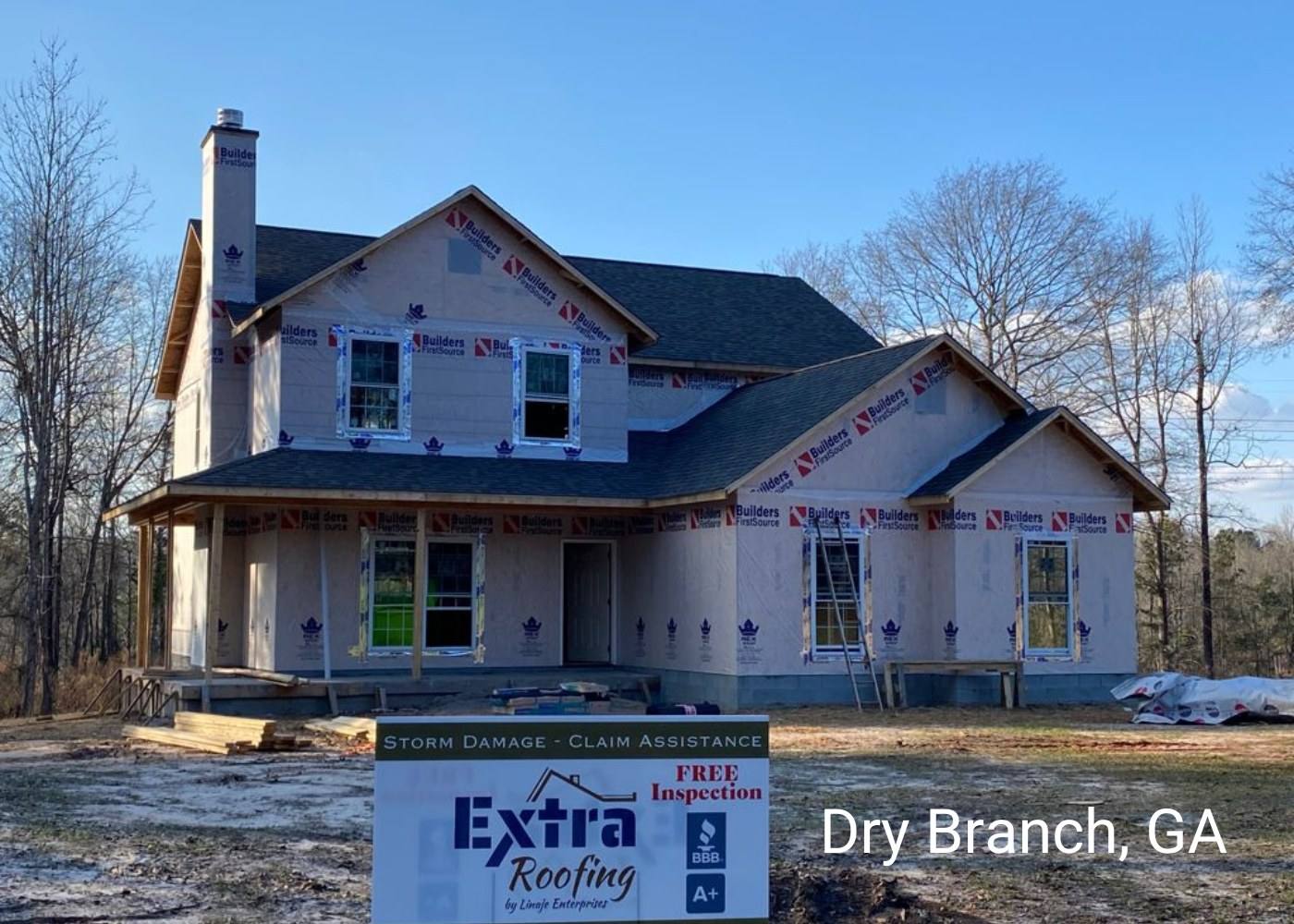 New-build home in Dry Branch, GA with a new roof and an Extra Roofing sign