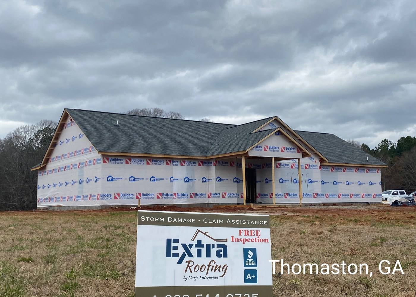 New-build home in Thomaston, GA with a new roof and an Extra Roofing sign